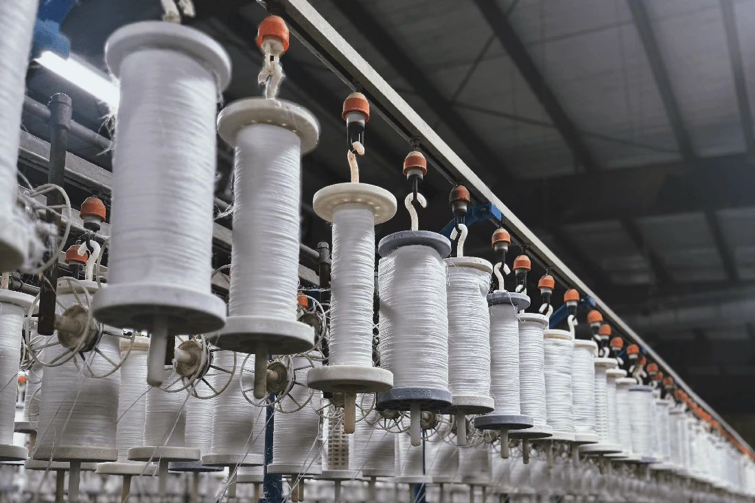 Linen yarn spools stacked in textile factory